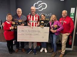 The Festive KryptoKloud Team donating to Lincoln Foodbank