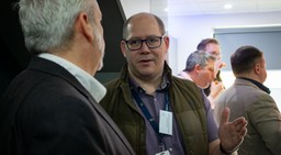 Two men discussing cybersecurity at the Cyber Seminar